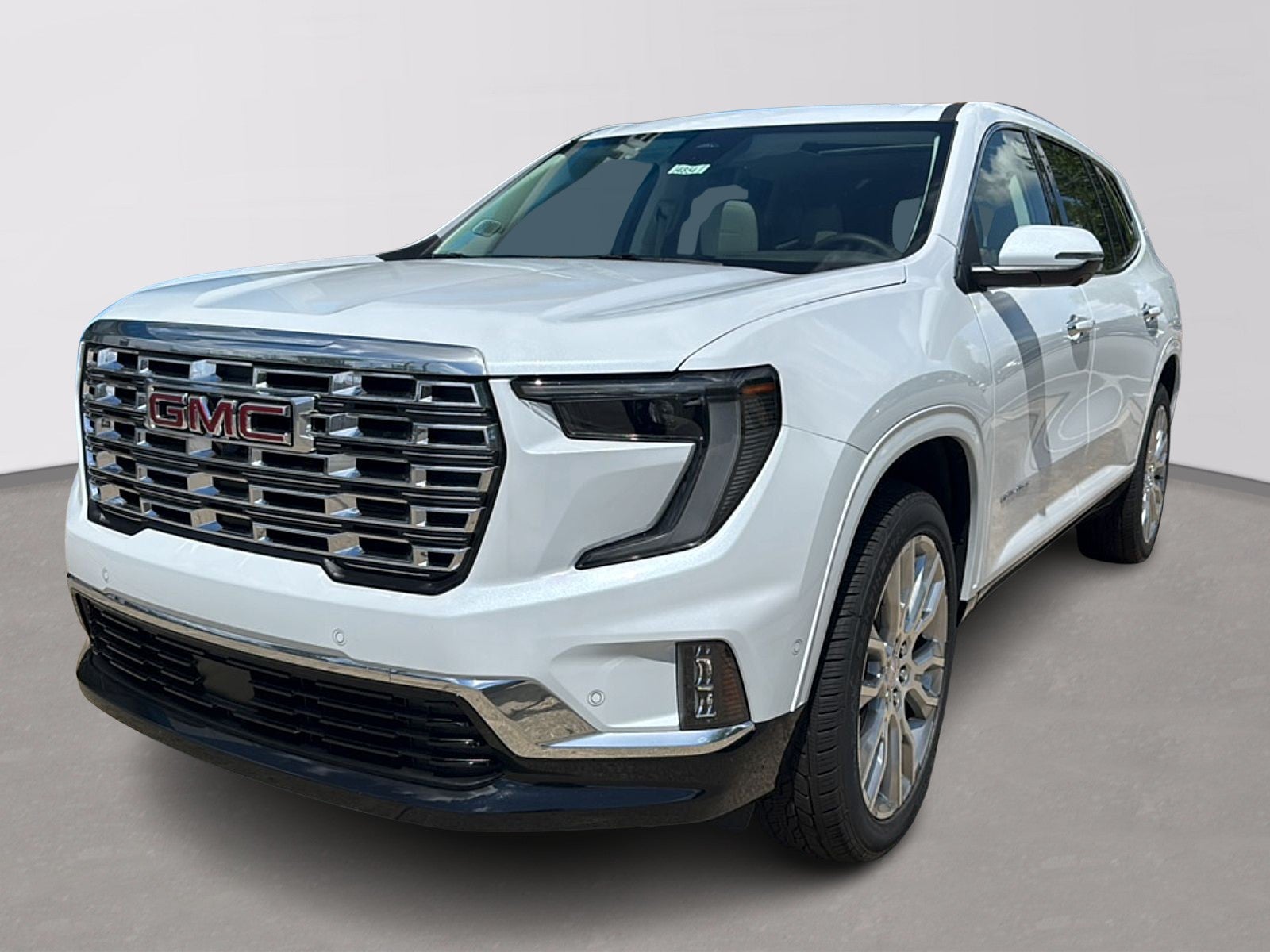 2026 GMC Acadia Denali in Glacier White Tricoat — front three-quarter view
