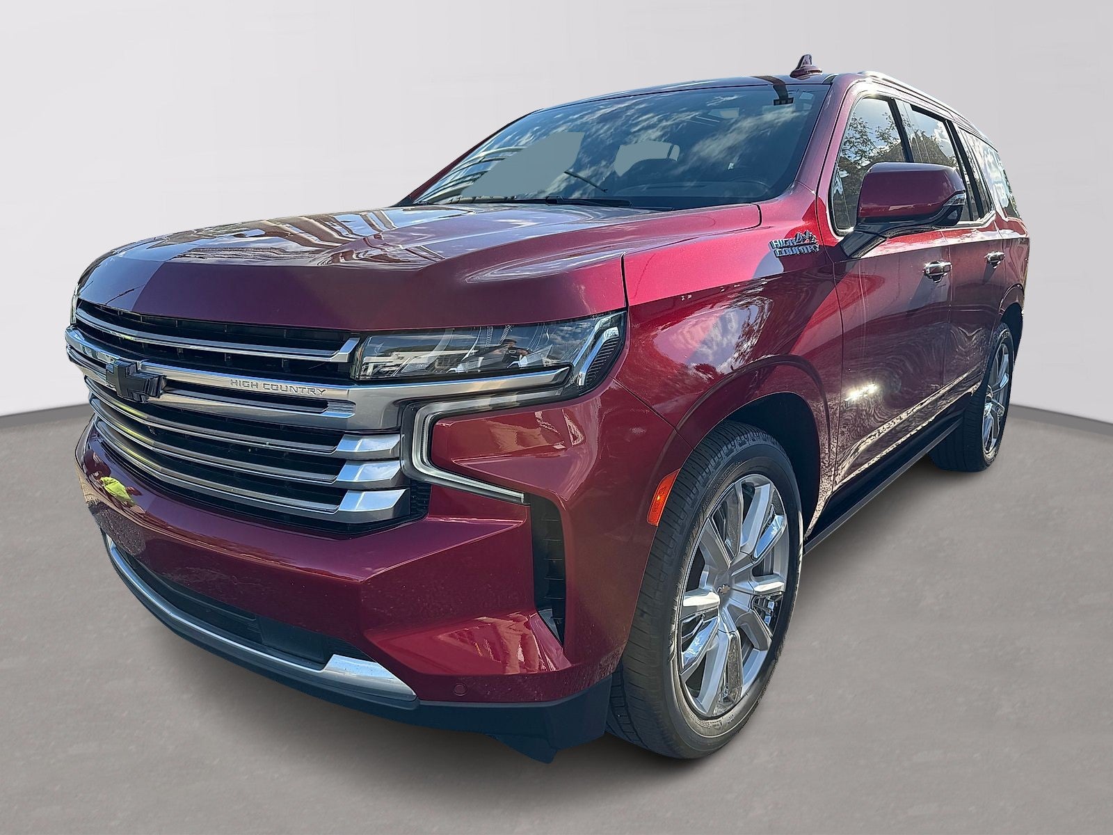 2021 Chevrolet Tahoe High Country in Cherry Red Tintcoat — front three-quarter view