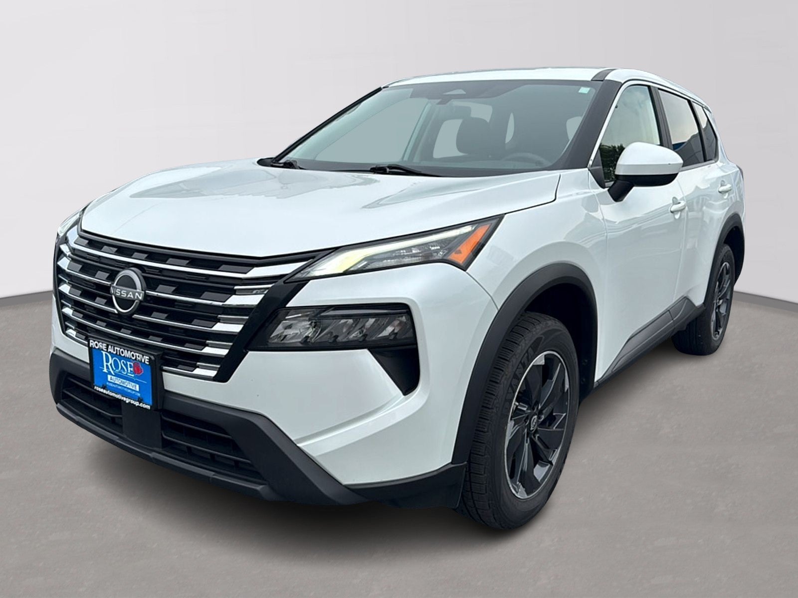 2024 Nissan Rogue SV in White — front three-quarter view