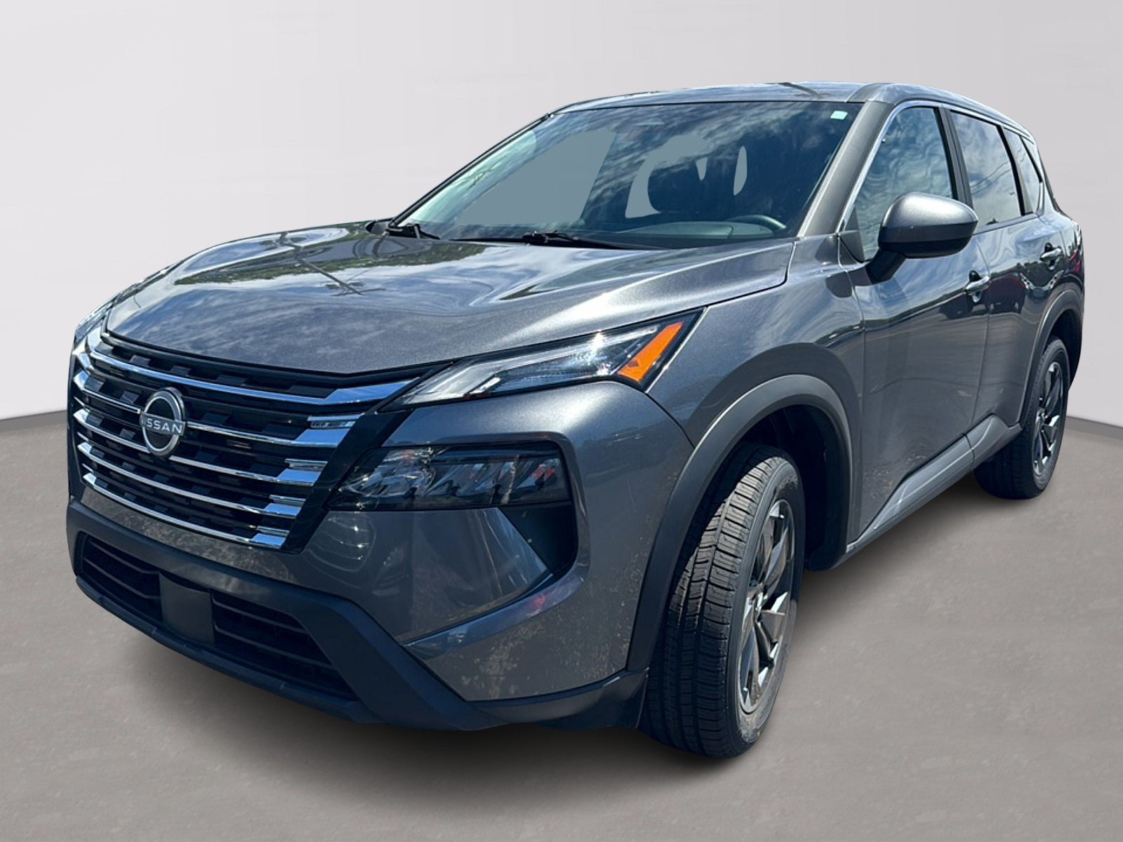 2025 Nissan Rogue SV in Gray — front three-quarter view
