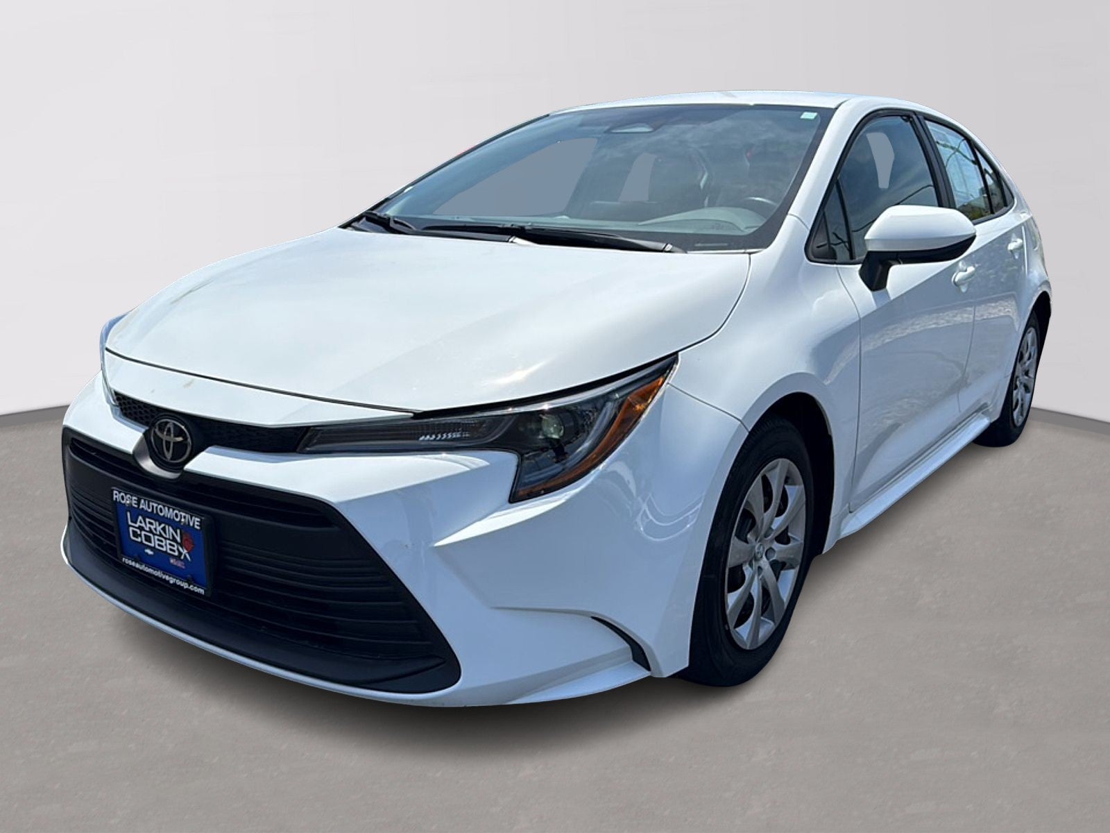 2025 Toyota Corolla LE in White — front three-quarter view